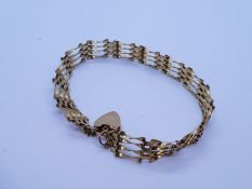 9ct yellow gold 4 bar gate link bracelet with heart shaped clasp and safety chain marked 375, approx