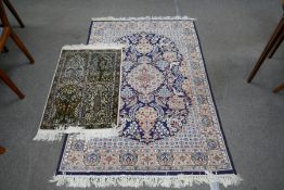 A small part silk rug, having four decorative panels and one other rug
