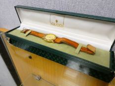 A boxed Gent's Gucci wristwatch