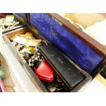 An antique box containing vintage costume jewellery, pens, etc