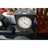 A Victorian black slate mantel clock