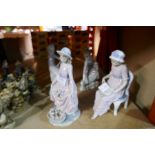 Four Lladro figures of girls including a seated female reading a book