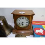 A 1930's style oak mantel clock and a brass barrel clock