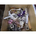 A box of mixed modern costume jewellery to include a Silver charm bracelet hung with various charms,