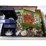 A tray of modern and vintage costume jewellery to include Swarovski brooches, hardstone beads, gilt