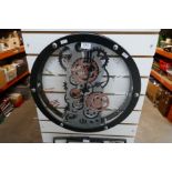A large wall clock with skeleton face