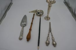 A silver handle pie server by Harrison Brothers, Sheffield 1972, and silver handled glove stretchers