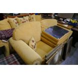 Two similar modern settees having gold upholstery with footstool