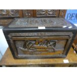 A small Chinese carved camphor wood chest, decorated boats, 44.5cms