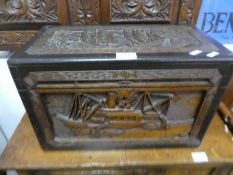 A small Chinese carved camphor wood chest, decorated boats, 44.5cms