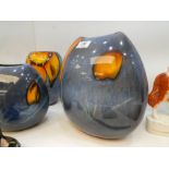 Three matching Poole Pottery vases of various sizes