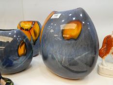 Three matching Poole Pottery vases of various sizes