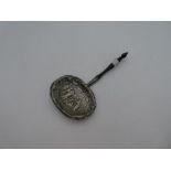 An ornate white metal sifter having pierced design. Very pretty, decorative design possibly of Virgi