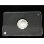 A Roman Imperial coin in a presentation case