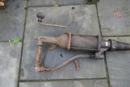 A vintage hand operated oil pump