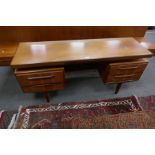 A G-Plan style teak dressing table having four drawers and a matching headboard with side tables