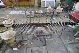An old iron semi circular garden bench of Regency style, normally for placing around a tree, width 1