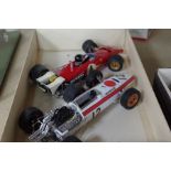 Two similar 1:12 scale 1960's Formula One cars, one being a Honda F1