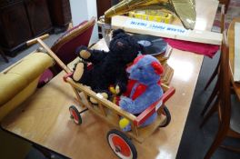 Two Steiff teddy bears and a Steiff pull along cart
