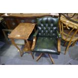 A reproduction green leather revolving desk chair and a two tier side table