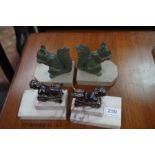 Two pairs of French Art Deco bookends, one of lying cherubs the other of squirrels eating nuts