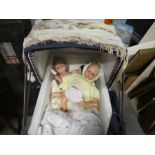 An old child's Silver Cross pram and dolls