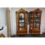 Two similar Chinese style display cabinets each having a drawer