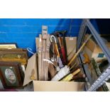 A box of vintage walking sticks, umbrellas, tennis rackets and an easel plus a couple of pictures