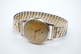 OMEGA; vintage 9ct yellow gold cased gent's Omega wristwatch, with orange patina dial, numbered dial