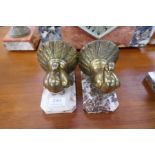 A pair of Art Deco bookends of Doveson marble bases