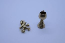 George Jensen; 2 9ct yellow gold charms, Pinnochio and a Goblet, both marked 2.9g approx