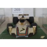 Tamiya; two 1:12 scale Formula One cars, one being a Ferrari 312T, both in perspex cases