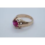 14ct yellow gold gent's ring with central claw mounted large synthetic Ruby, size Q, marked 585, app