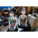 A pair of painted wooden figures of Thai style lady and gent