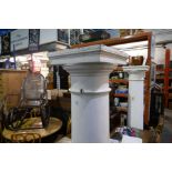 A pair of fibreglass columns on square bases