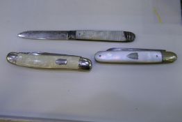 Three silver bladed penknives, one with mother of pearl handle