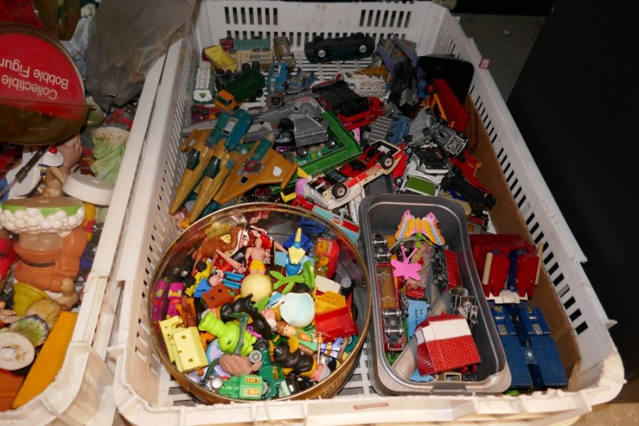 A quantity of toys and some die cast vehicles