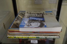 Thirteen various Beatles albums, a book and a magazine