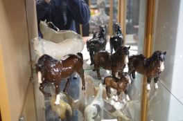 Two shelves of Beswick Horse figures, 11