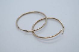 Pair of 9ct yellow gold hoop earrings, approx 2.5cm diameter, marked 9ct, 0.8g approx