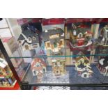 Lemax;Two shelves of small Christmas model displays (12)