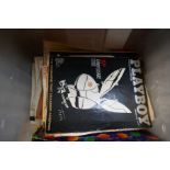 A selection of ephemera including some vintage Playboy magazines, a boxed collection of postcards, a