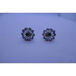 Pair of pretty 9ct emerald and diamond flower head design earrings, with butterfly backs, marks worn