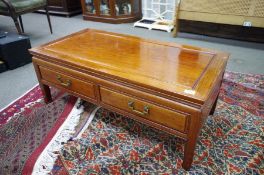 A modern Chinese hardwood two drawer coffee table