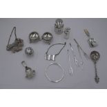 A quantity of silver items to include a pair of decorative salts with repoussé design, beaded rim an