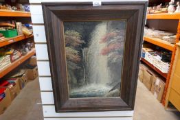 A framed and glazed picture of a waterfall