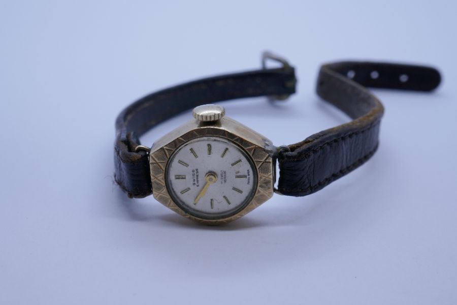 Vintage 9ct gold cased ladies wristwatch 'Swiss Empress', marked 375, on brown leather strap