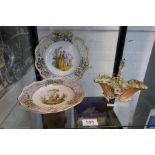 A 19th century floral encrusted basket probably by Rockingham and a pair of Meissen style plates hav