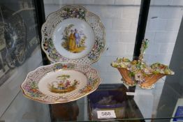 A 19th century floral encrusted basket probably by Rockingham and a pair of Meissen style plates hav