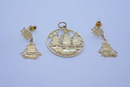 14K yellow gold circular oriental design medallion, depicting a galleon and pair matching 14K gold d